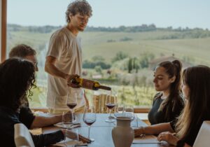 montepulciano wine tour sommelier puring wine during a private wine tasting