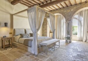 boutique hotel room detail vacation stay tuscany canopy bed