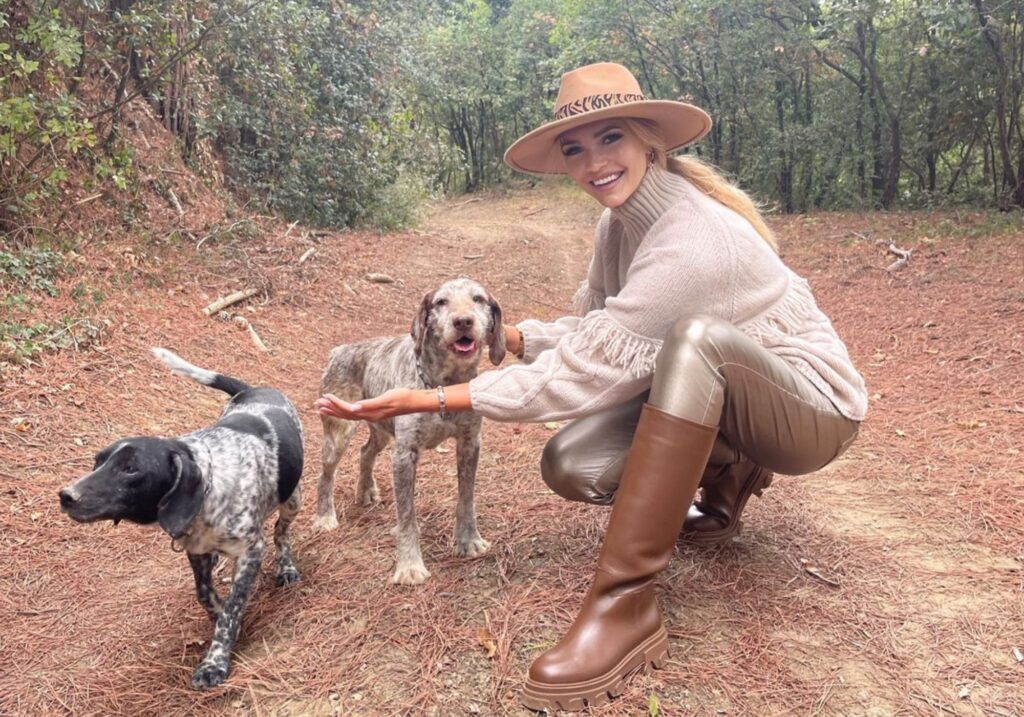 truffle hunting experience girl with dogs pine needles