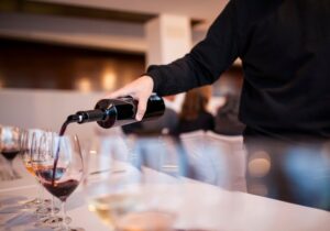 wine tasting puring red wine in the glass