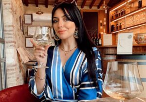 wine tasting tuscany woman white wine cellar experience